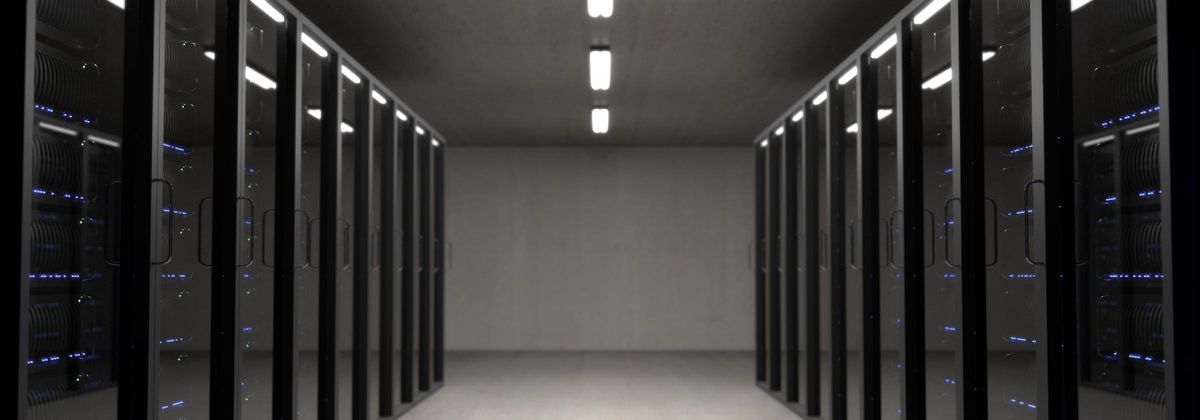 Data center corridor representing unseen infrastructure dependencies and migration exposure